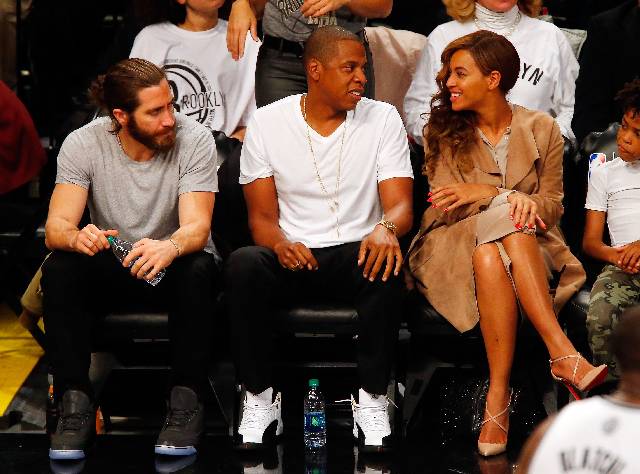 NEW YORK, NY - MAY 10: (NEW YORK DAILIES OUT) Actor Jake Gyllenhall and recording artists Jay-Z and Beyonce attend Game Three of the Eastern Conference Semifinals during the 2014 NBA Playoffs between the Brooklyn Nets and the Miami Heat at Barclays Center on May 10, 2014 in the Brooklyn borough of New York City. The Nets defeated the Heat 104-90 and trail the best of seven series two games to one. NOTE TO USER: User expressly acknowledges and agrees that, by downloading and/or using this Photograph, user is consenting to the terms and conditions of the Getty Images License Agreement. (Photo by Jim McIsaac/Getty Images)