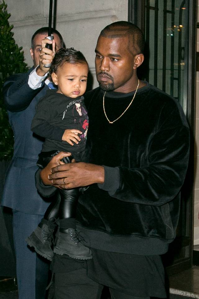 PARIS, FRANCE - SEPTEMBER 24: Kanye West and North West leave the 'Art District' apartments on September 24, 2014 in Paris, France. (Photo by Marc Piasecki/GC Images)