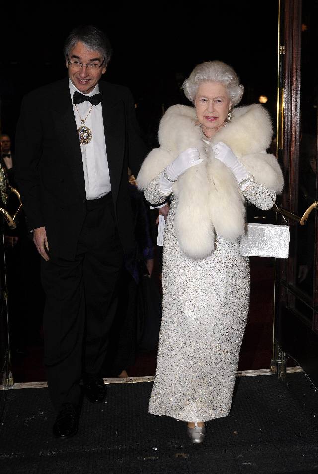 LIVERPOOL, ENGLAND - DECEMBER 3: (NO PUBLICATION IN UK MEDIA FOR 28 DAYS) Queen Elizabeth II, greeted by The Lord Mayor of Liverpool Councillor Paul Clark, arrives at the Empire Theatre for the 2007 Royal Variety Performance on Dec. 3, 2007 in Liverpool, England. (Photo by POOL/ Tim Graham Picture Library/Getty Images)