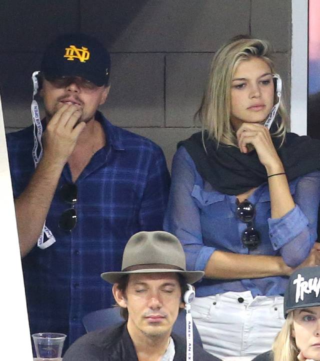 NEW YORK, NY - SEPTEMBER 13: Leonardo DiCaprio, Kelly Rohrbach and Lukas attend the Men's Final on day fourteen of the 2015 US Open at USTA Billie Jean King National Tennis Center on September 13, 2015 in the Flushing neighborhood of the Queens borough of New York City. (Photo by Jean Catuffe/GC Images)