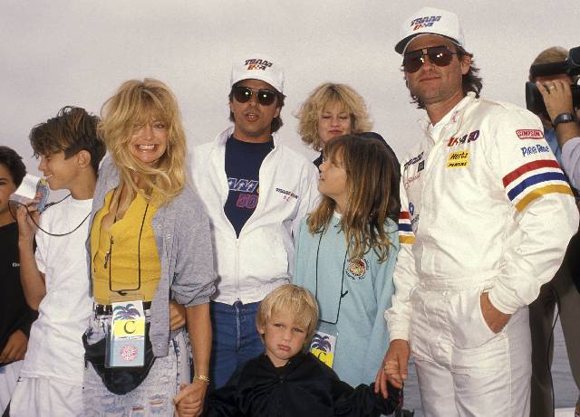 LONG BEACH, CA - APRIL 14: Actor Kurt Russell, actress Goldie Hawn, son Oliver Hudson, son Wyatt Russell, daughter Kate Hudson, actor Don Johnson and actress Melanie Griffith attend the 1990 Pacific Offshore Powerboat Races on April 14, 1990 at the Catalina Express Docks in Long Beach, California. (Photo by Ron Galella, Ltd./WireImage)