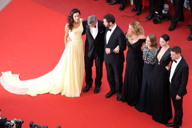 CANNES, FRANCE - MAY 12: Actors George Clooney and his wife Amal Clooney, actors Dominic West, Julia Roberts, producer Jodie Foster, actors Caitriona Balfe and Jack O'Connell attend the 